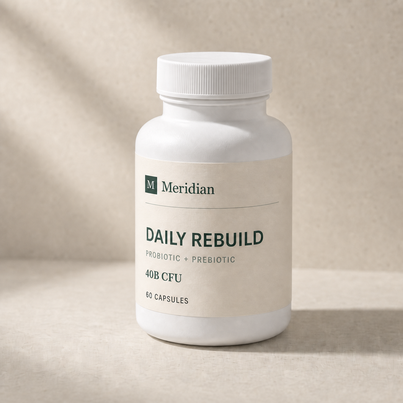 Meridian Daily Rebuild bottle on warm limestone
